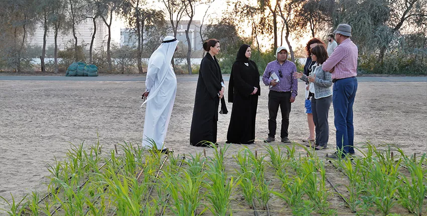 H.E. Mariam Almheiri and H.E. Sarah Al Amiri at another demo plot.